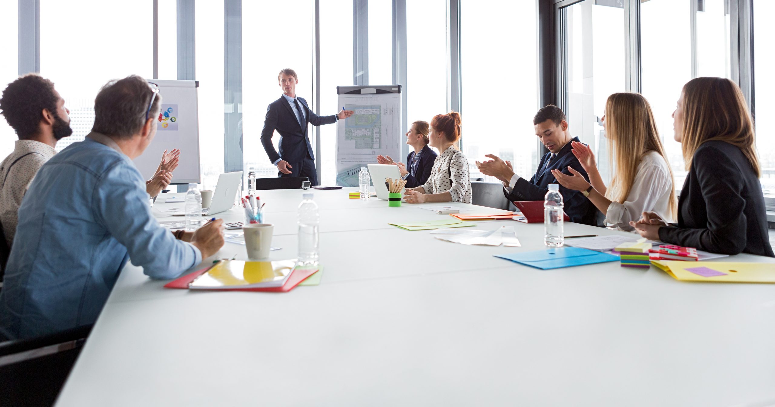 Business man talking about project during meeting in modern office. Business man talking about project during meeting in modern office.